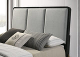 Cama Arini tapizada con paneles en color negro y gris