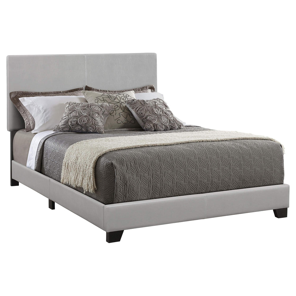 Cama Dorian tapizada en piel sintética gris con paneles completos