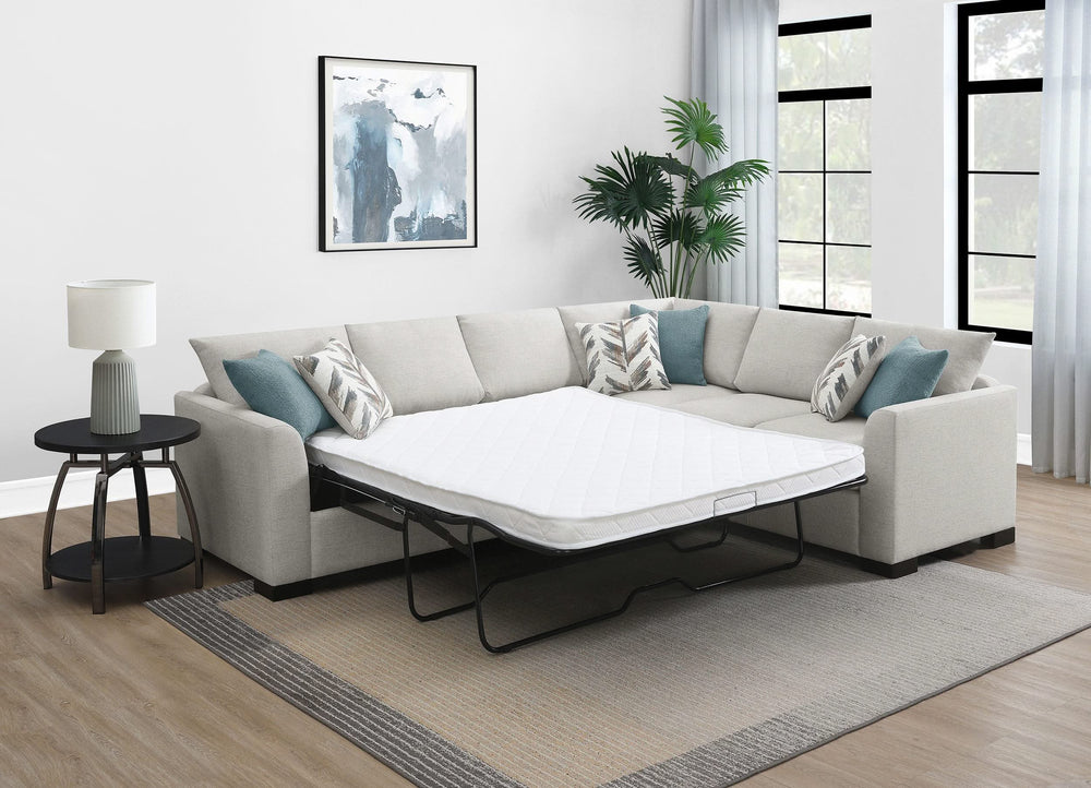 Sofá cama seccional tapizado en chenilla Ashford en color grisáceo
