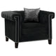 Sillón tapizado con brazos de riel Reventlow, color negro