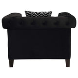 Sillón tapizado con brazos de riel Reventlow, color negro