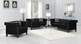 Sillón tapizado con brazos de riel Reventlow, color negro