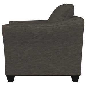 Sillón Salizar tapizado con brazos acampanados, color gris carbón