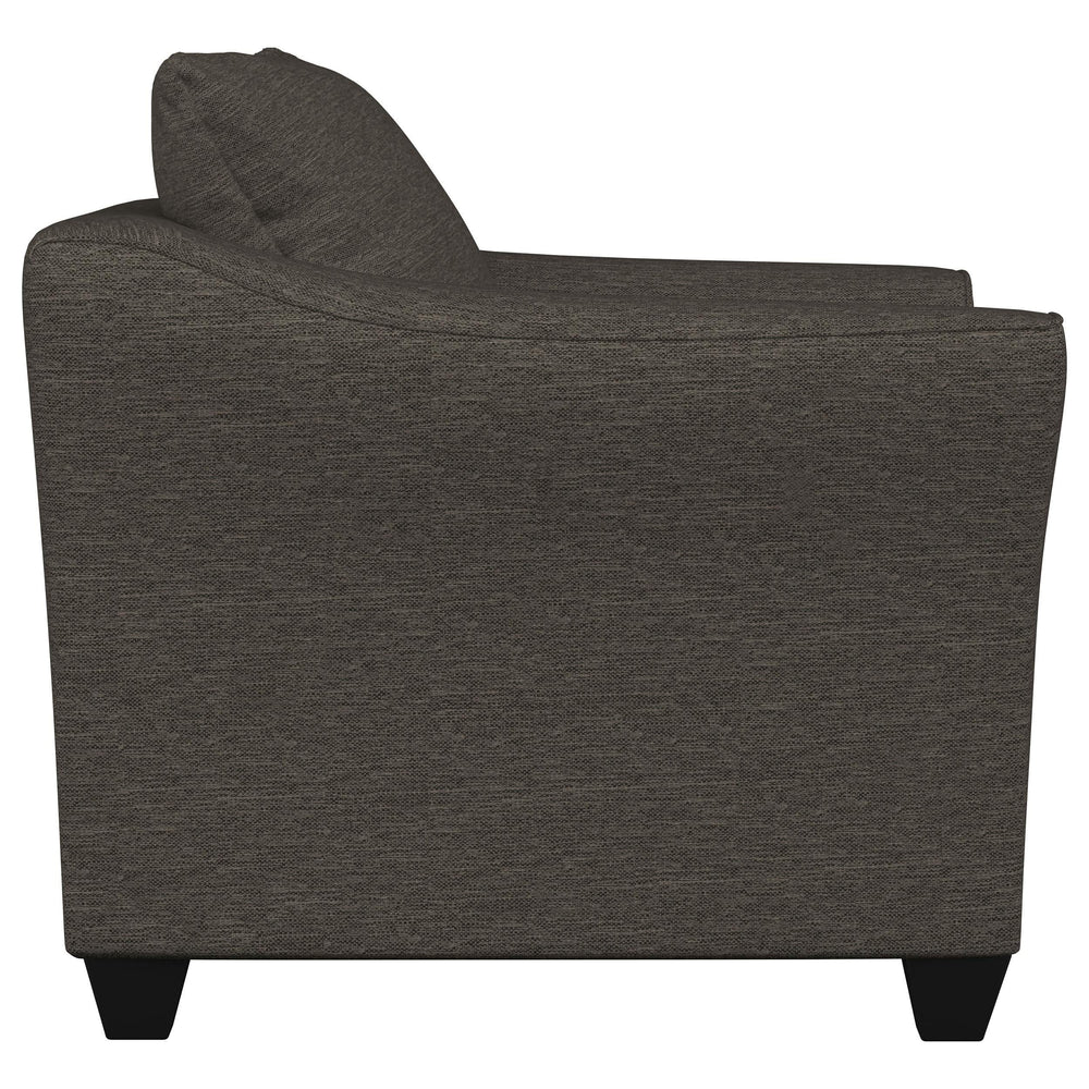 Sillón Salizar tapizado con brazos acampanados, color gris carbón