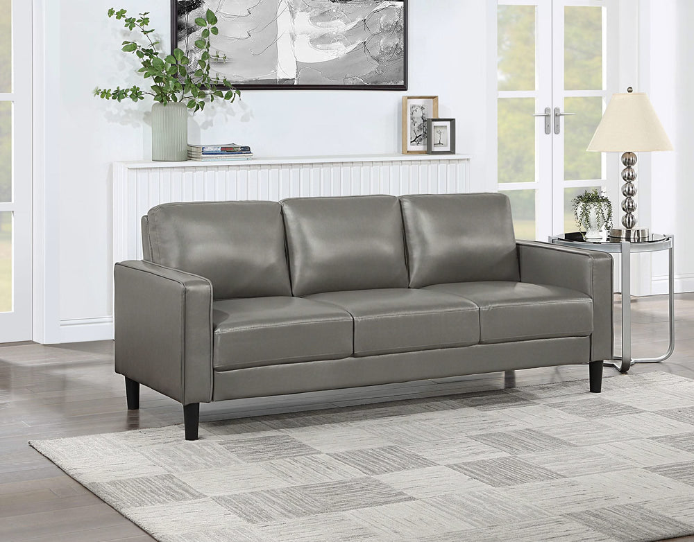 Sofá tapizado Ruth con brazos en gris