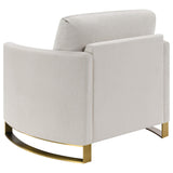 Sillón Corliss tapizado con brazos curvos en beige