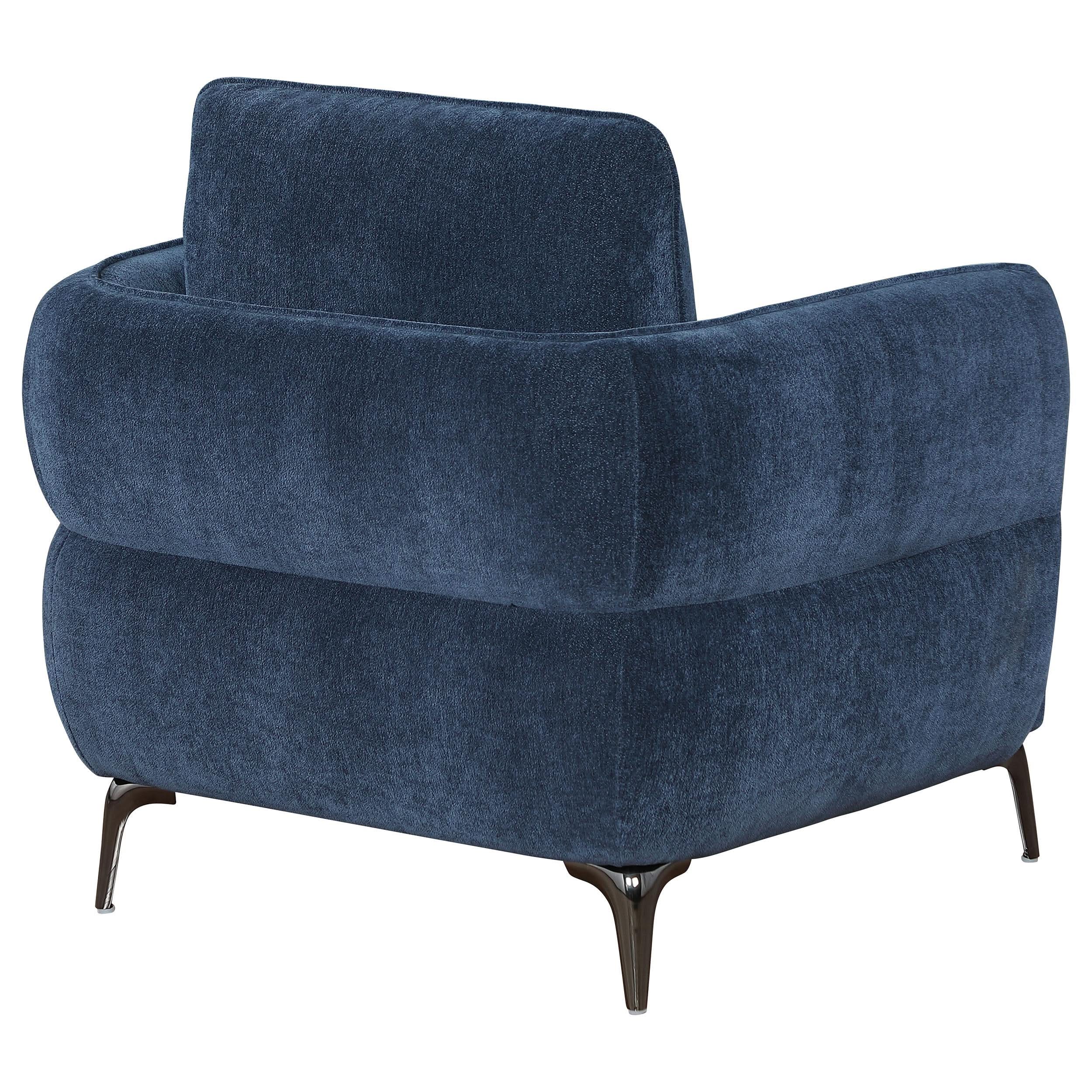 Sillón moderno tapizado en chenilla con brazos en azul