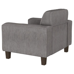 Sillón tapizado Deerhurst con brazos articulados y capitoné, color carbón