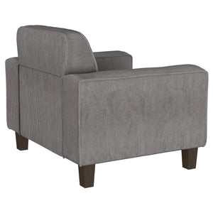 Sillón tapizado Deerhurst con brazos articulados y capitoné, color carbón