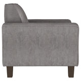 Sillón tapizado Deerhurst con brazos articulados y capitoné, color carbón