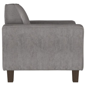 Sillón tapizado Deerhurst con brazos articulados y capitoné, color carbón