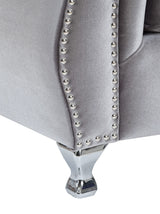Silla decorativa capitoné con brazos enrollados y tapizada Frostine, color plateado