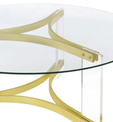 Mesa de centro Janessa redonda con tapa de vidrio y patas acrílicas, latón mate