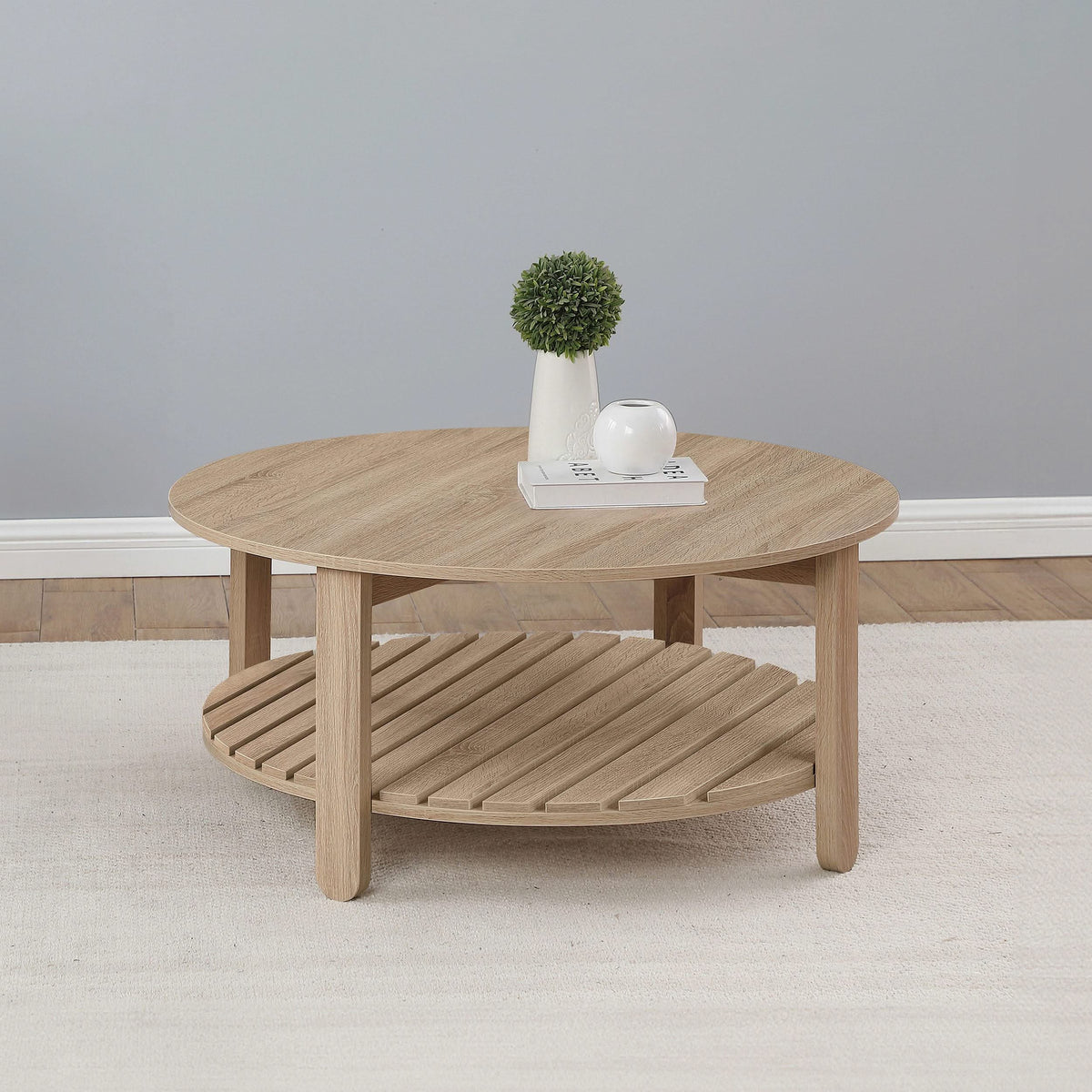 Mesa de centro redonda de madera de ingeniería Fowler de 1 estante, color natural