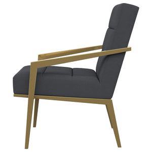Sillón Kirra tapizado con brazos de metal, color gris oscuro