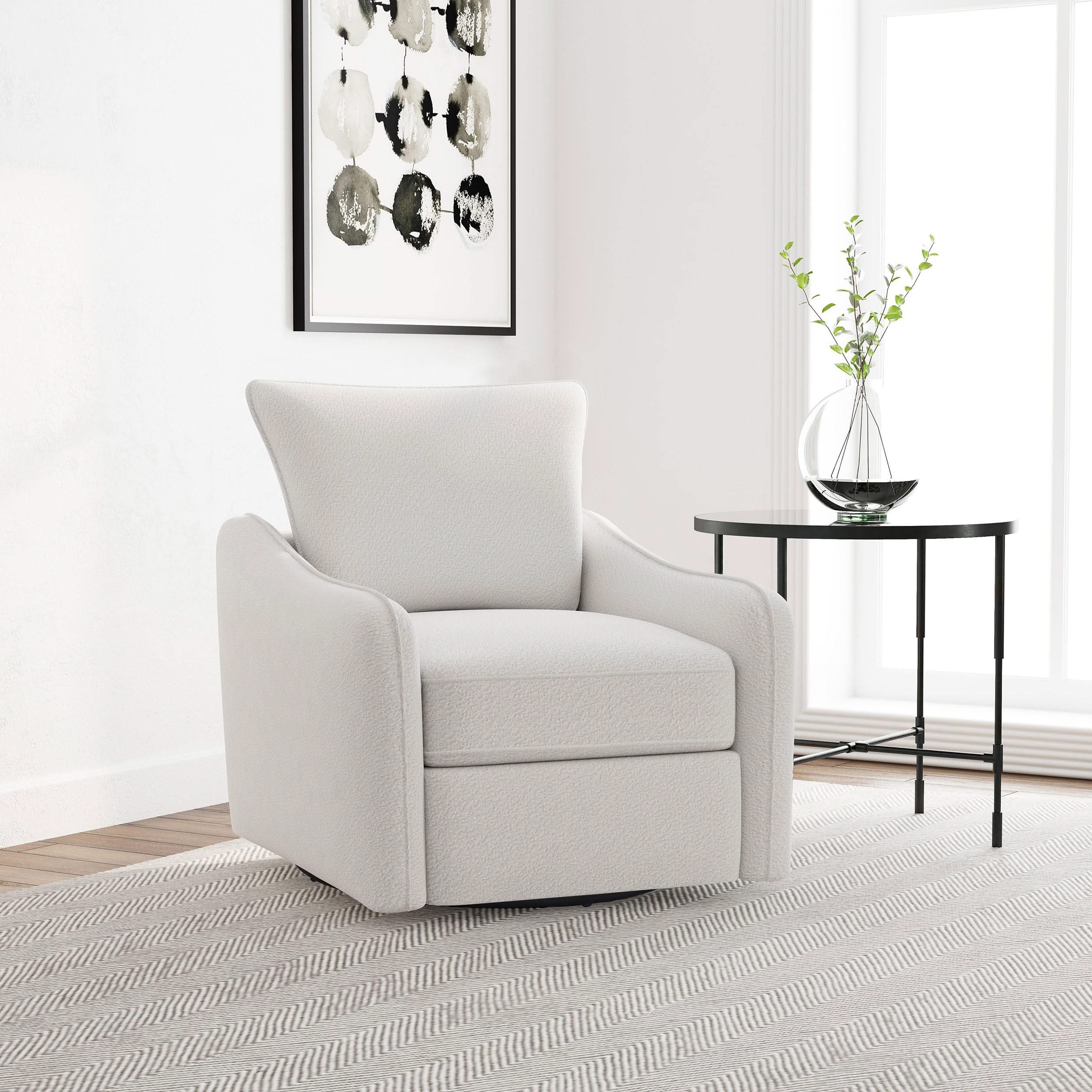 Sillón giratorio con brazo inclinado tapizado Madia, color vainilla