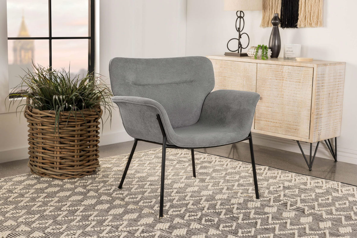 Sillón Davina tapizado con brazos acampanados, color gris ceniza
