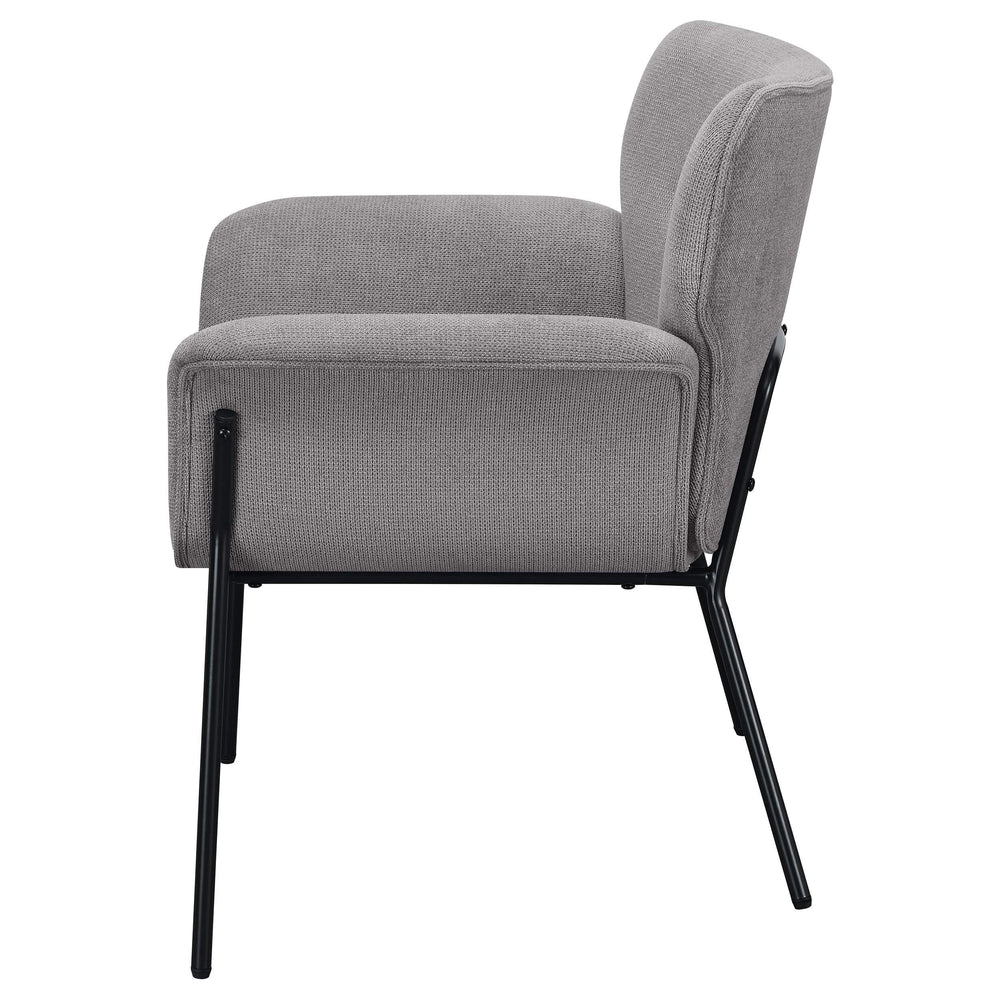 Sillón Davina tapizado con brazos acampanados, color gris ceniza