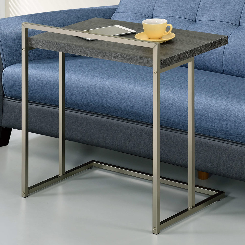 Mesa auxiliar rectangular Dani en forma de C, color gris desgastado
