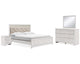 Altyra King Upholstered Panel Bed, Dresser, Mirror, and Nightstand
