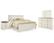 Cama Willowton King con paneles, tocador, espejo y mesita de noche
