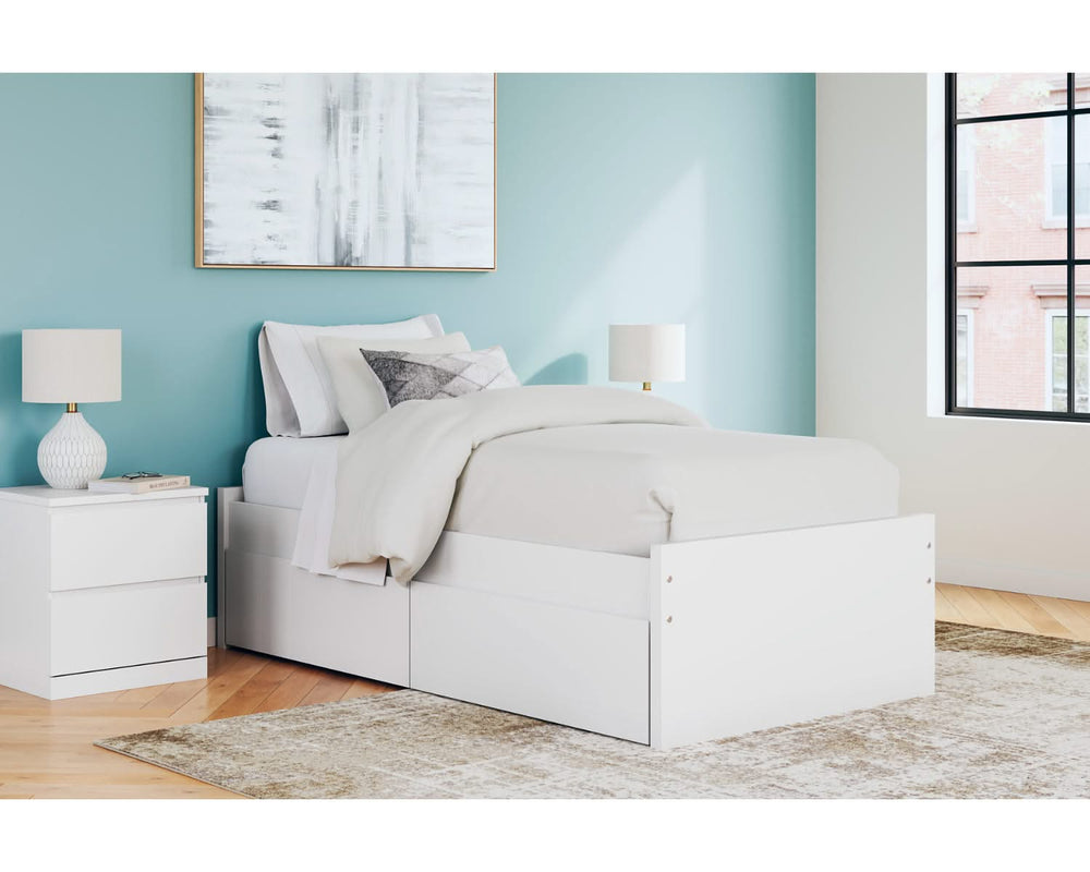 Cama individual con plataforma Onita y espacio de almacenamiento en un lateral