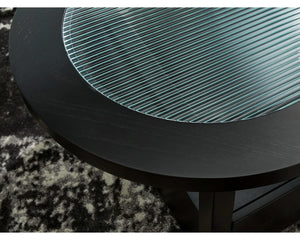 Mesa de centro Winbardi y dos mesas auxiliares junto a la silla